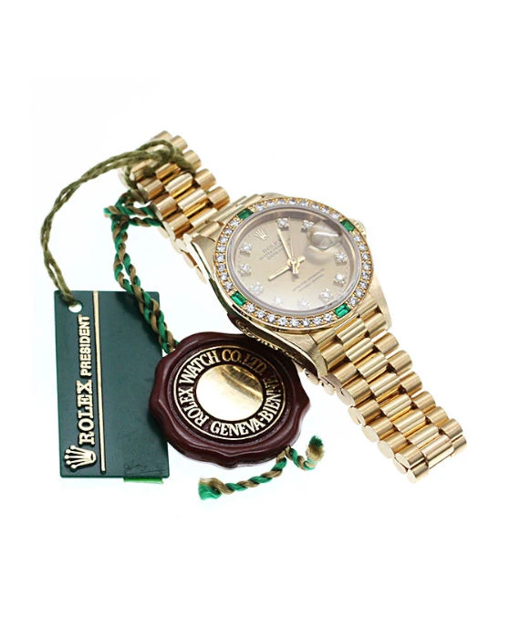 Rolex 69078G Datejust 26mm Champagne Dial in 18k Yellow Gold with Emerald and Diamonds Women's Watch